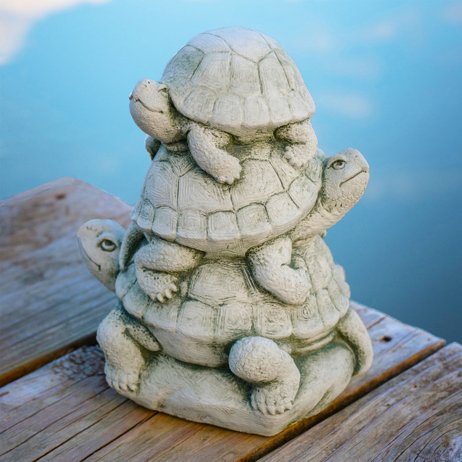 Handcrafted stone sculpture of three turtles stacked on top of each other by Carruth Studio